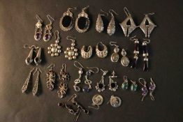 Seventeen pairs of white metal and silver earrings, including pairs set with onyx, amethyst,