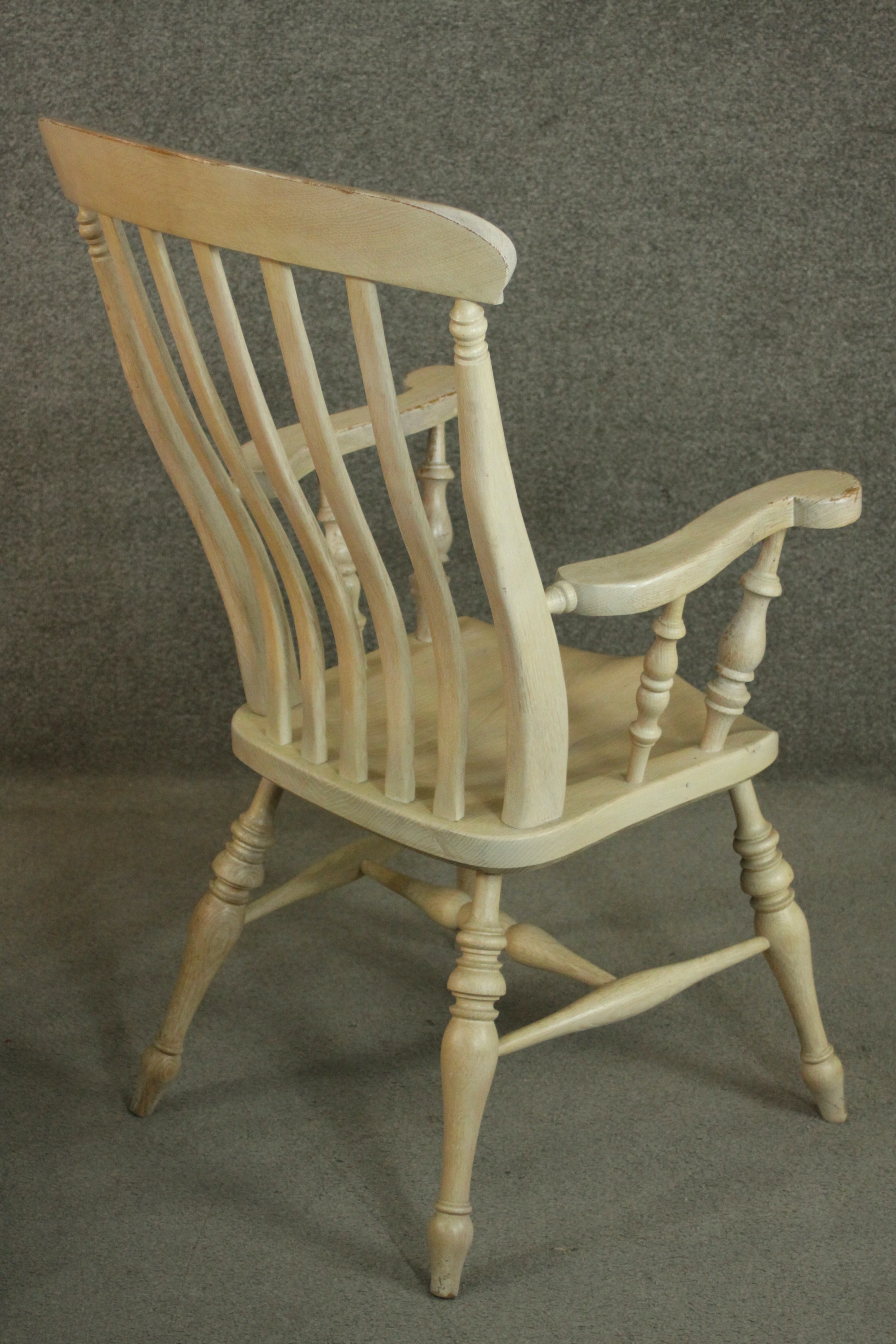 A pair of late 20th century oak Windsor carver chairs, with a comb back above a shaped seat on - Image 6 of 10