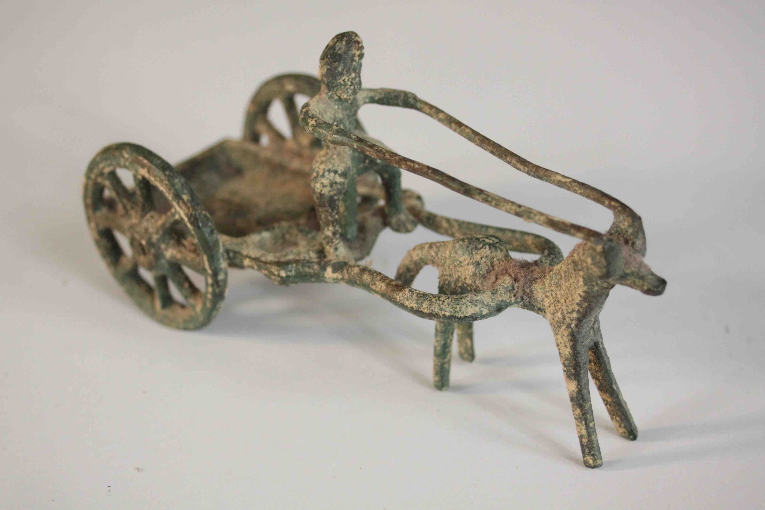 An ancient Greek style bronze of a man riding a horse drawn cart. H.8 W.14 D.6cm. - Image 4 of 8