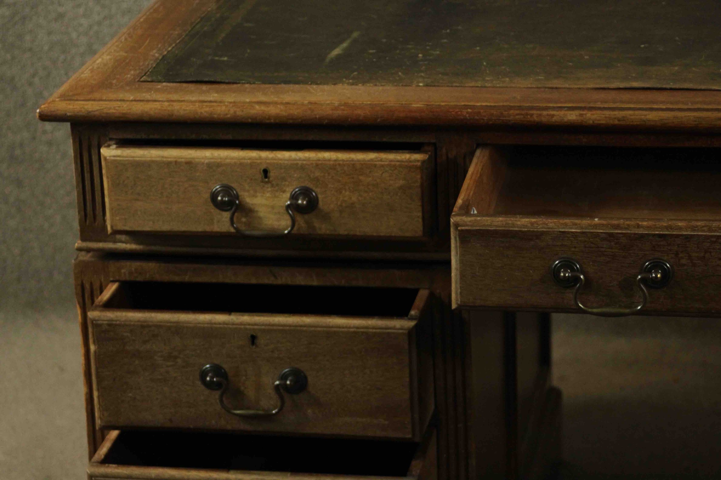 An early 20th century pedestal desk, with a leather writing insert over an arrangement of nine - Image 4 of 11