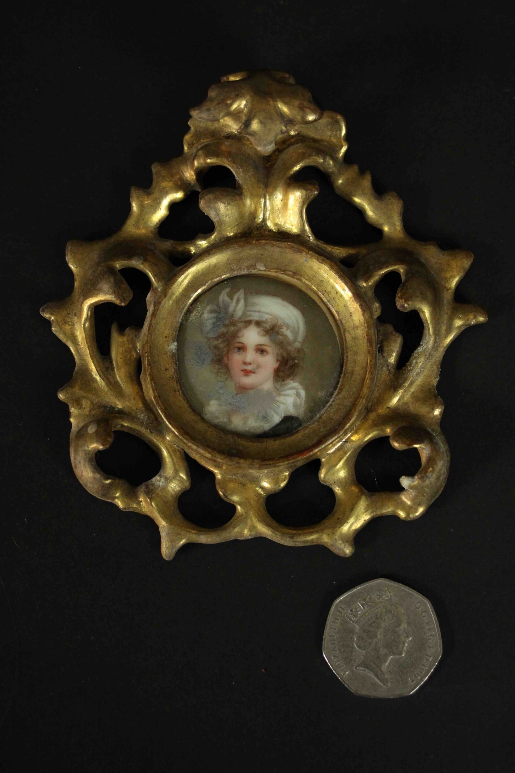 A pierced and carved giltwood framed hand painted miniature portrait on porcelain of a young lady, - Image 2 of 4