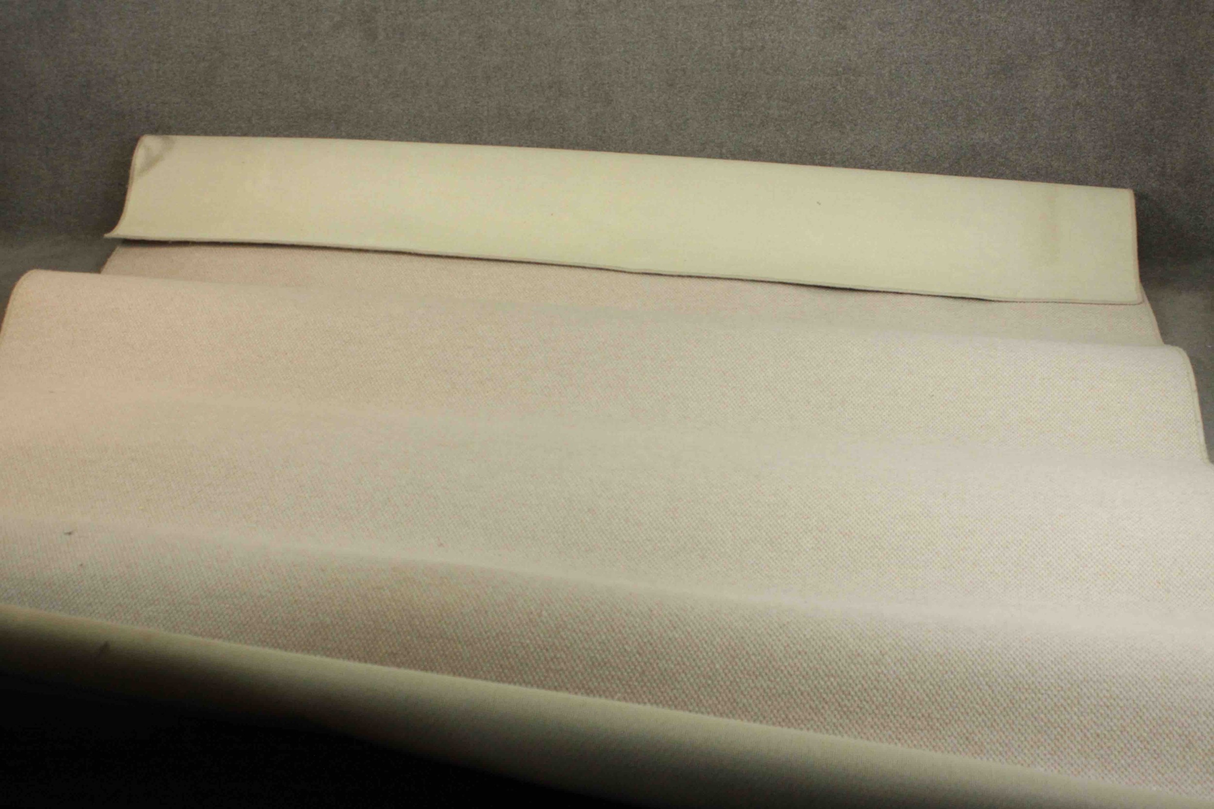 A contemporary cream cord matted carpet. H.390 W.280cm.