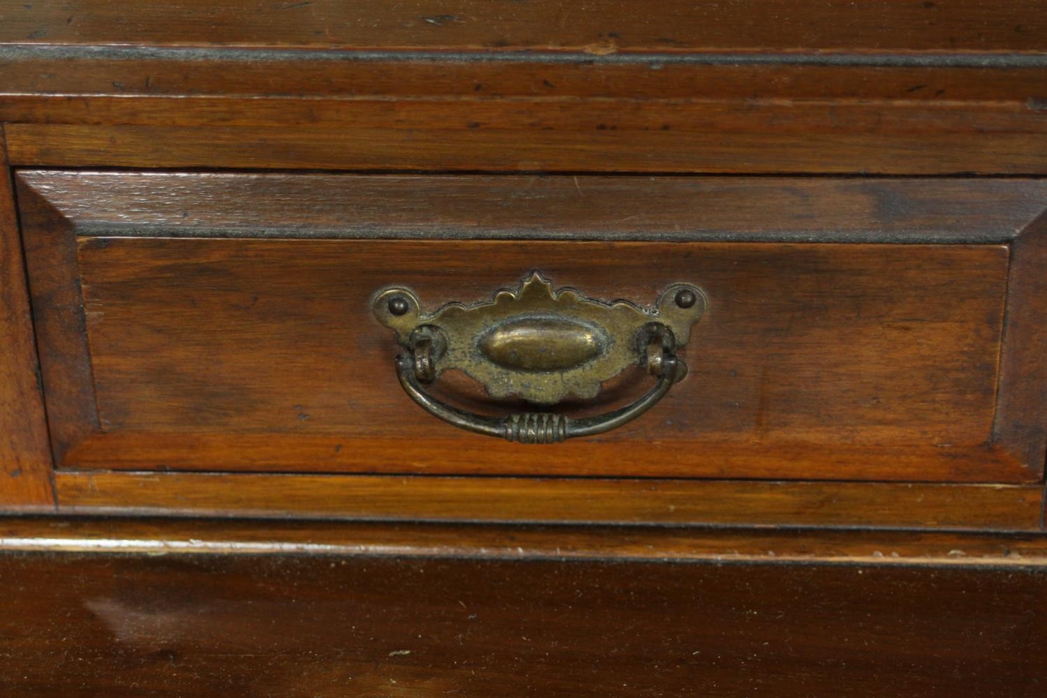 A late Victorian walnut dressing chest, with a central bevelled swing frame mirror, flanked by two - Image 7 of 11