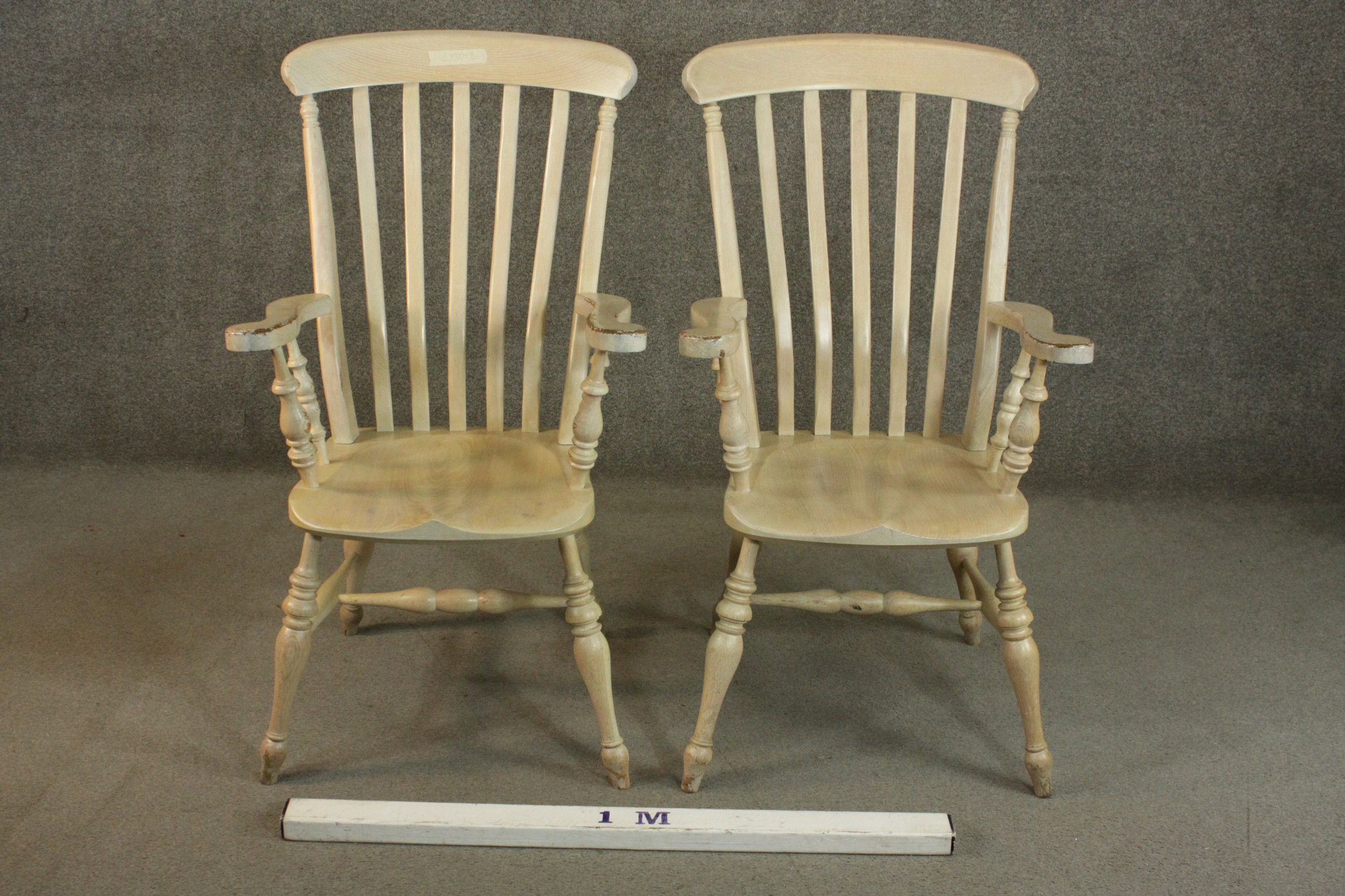 A pair of late 20th century oak Windsor carver chairs, with a comb back above a shaped seat on - Image 2 of 10