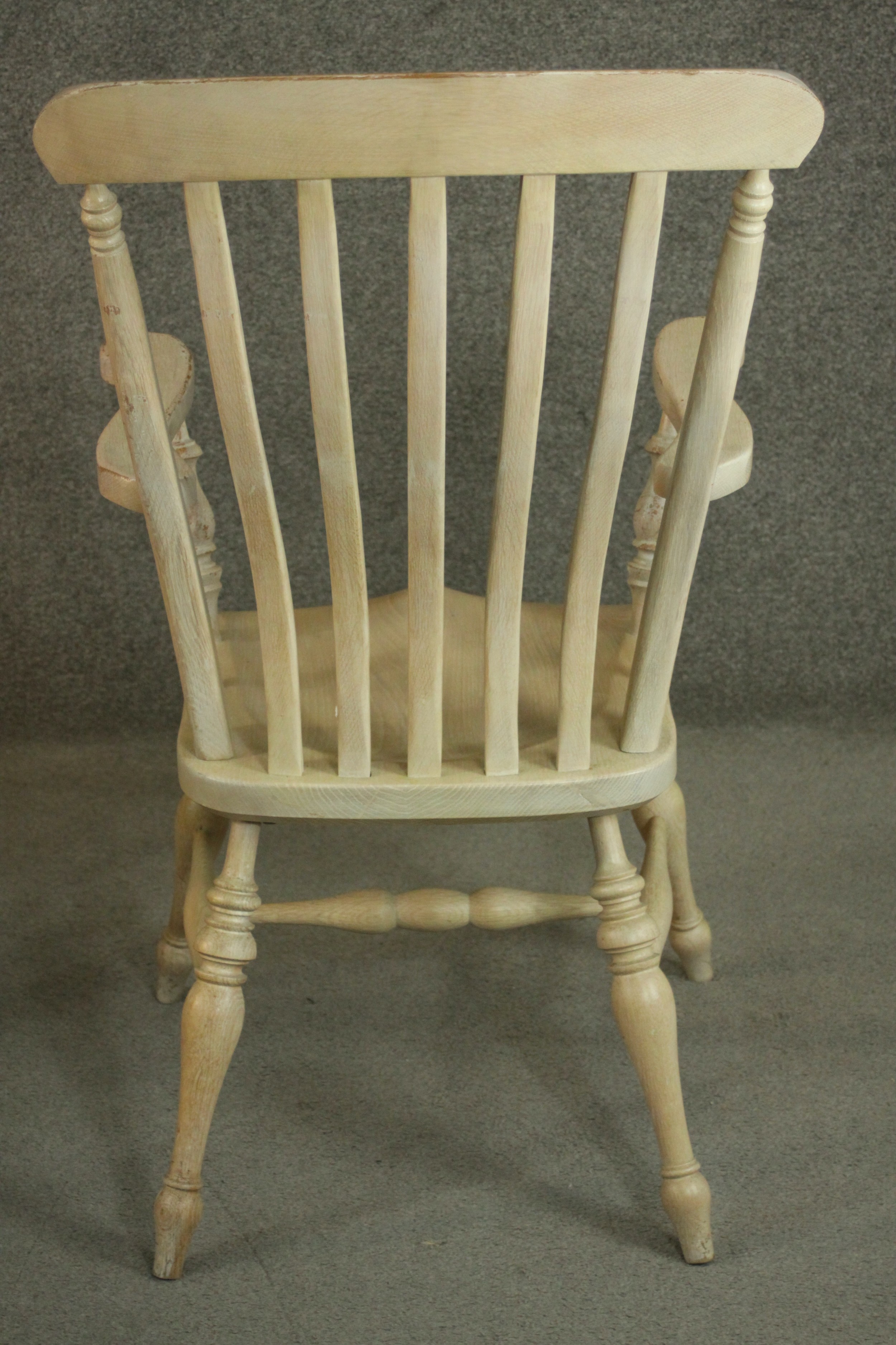 A pair of late 20th century oak Windsor carver chairs, with a comb back above a shaped seat on - Image 7 of 10
