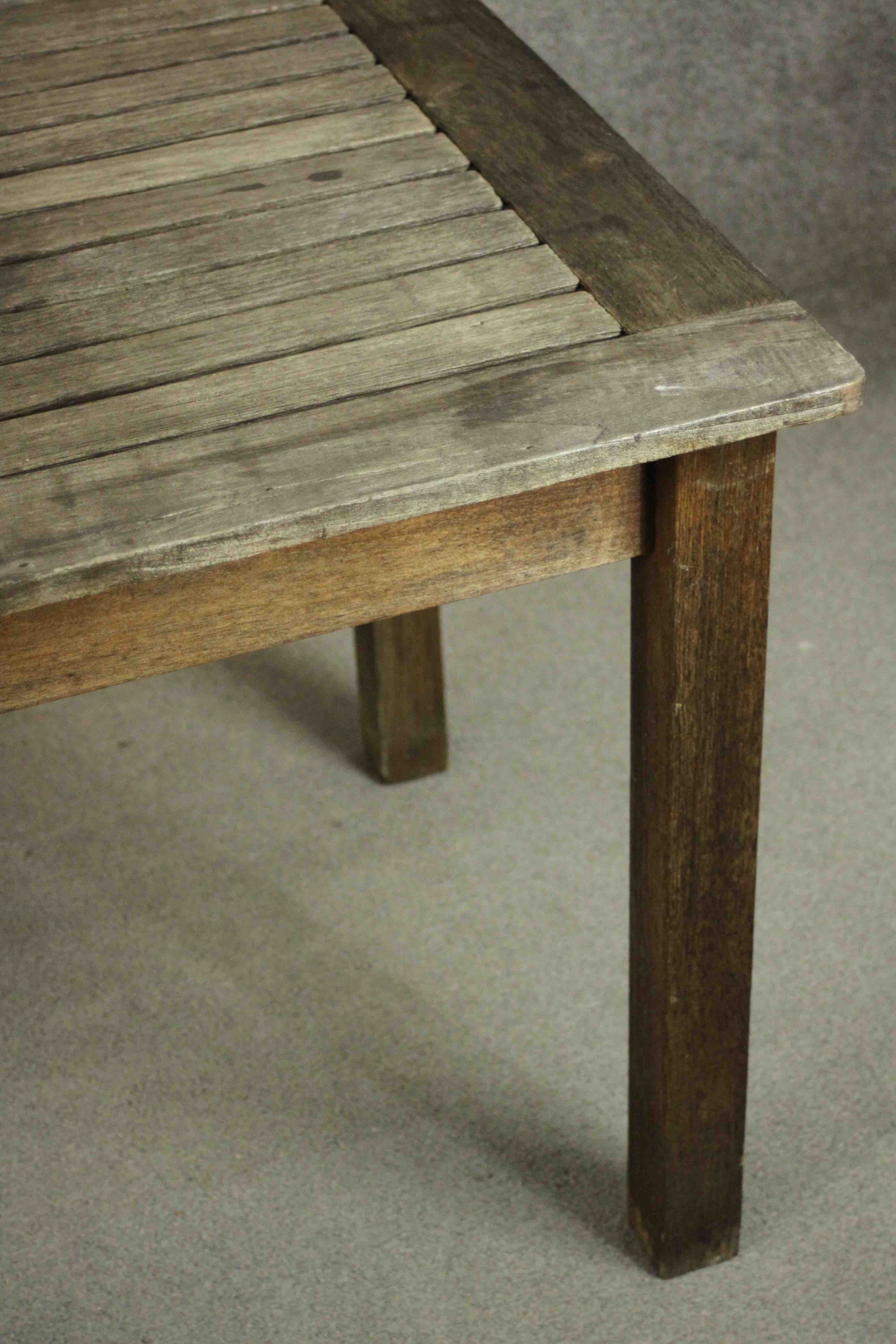 A contemporary Barlow and Tyrie oak garden dining table, with a rectangular slatted top on square - Image 6 of 8