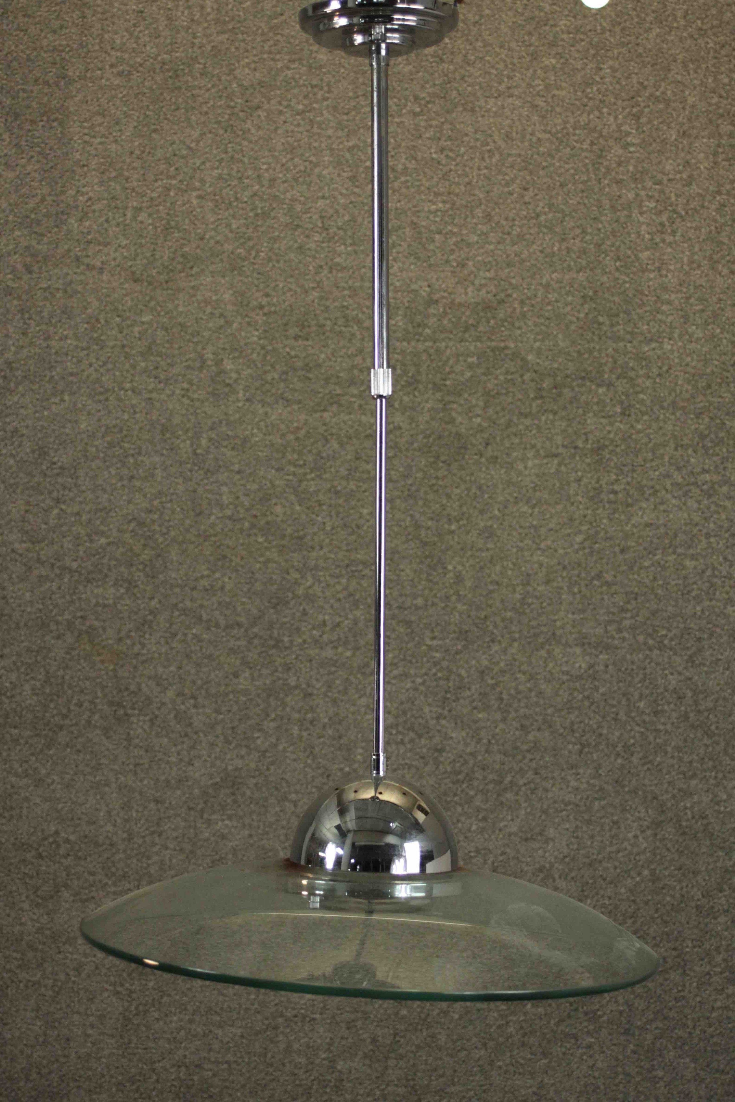DAR Lighting; A Hemisphere 1 flying saucer style pendant light, with a telescopic chrome stem,