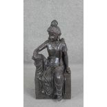 An Indian bronze effect moulded statue of seated Buddha. H.67 W.31 D.30cm.