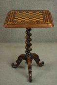 A mid Victorian rosewood and satinwood chessboard inlaid occasional table on spiral twist support