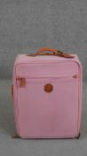 A small pale pink leather wheel along Bric's cabin bag with tan detailing. H.54 W.40 D.22cm.