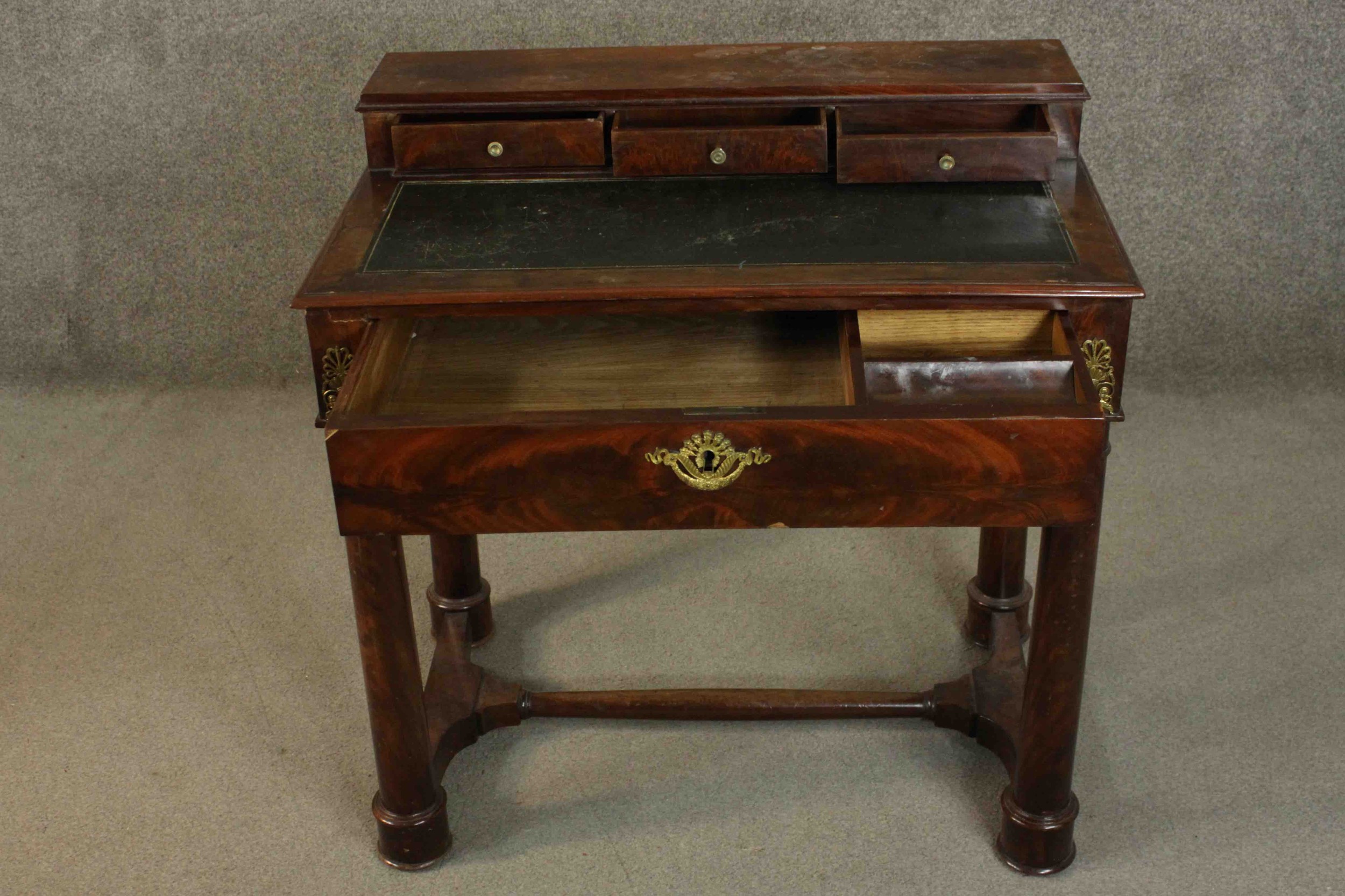 A French Empire flame mahogany writing table, the superstructure with three short drawers, over a - Image 7 of 9