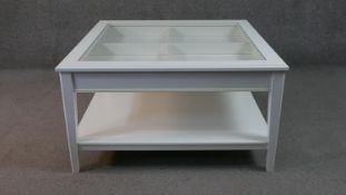 A contemporary vitrine style coffee table with fitted drawer and undertier. H.50 W.93 D.93cm
