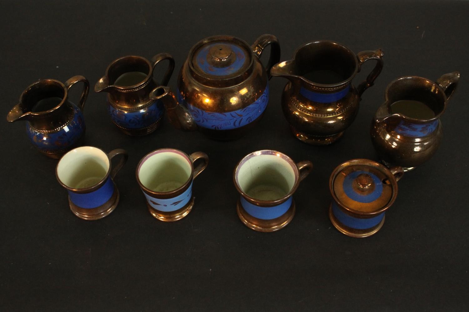 A collection of 19th century copper lustre items, comprising a teapot, jugs, cups, and a preserve - Image 3 of 8