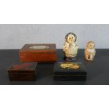 A collection of hand painted boxes, including two Russian doll boxes. H.6.5 W.17 D.12.5cm (largest)