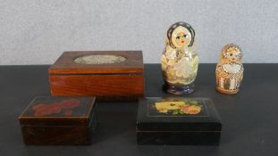 A collection of hand painted boxes, including two Russian doll boxes. H.6.5 W.17 D.12.5cm (largest)