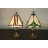 Two reproduction Tiffany style table lamps, with stained glass shades, on similar bases to each