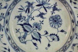 A collection of hand painted 19th century Meissen porcelain, including a Blue Onion pattern plate