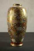A Japanese Satsuma porcelain vase, of baluster form with a gilt ground painted with chrysanthemum