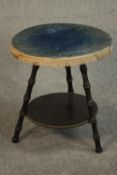 A Victorian circular gypsy table, the blue velvet top with tassels to the sides, on ebonised faux