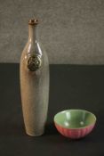 A 20th century dappled glaze Oriental bottle with impressed seal along with a celadon and pink glaze