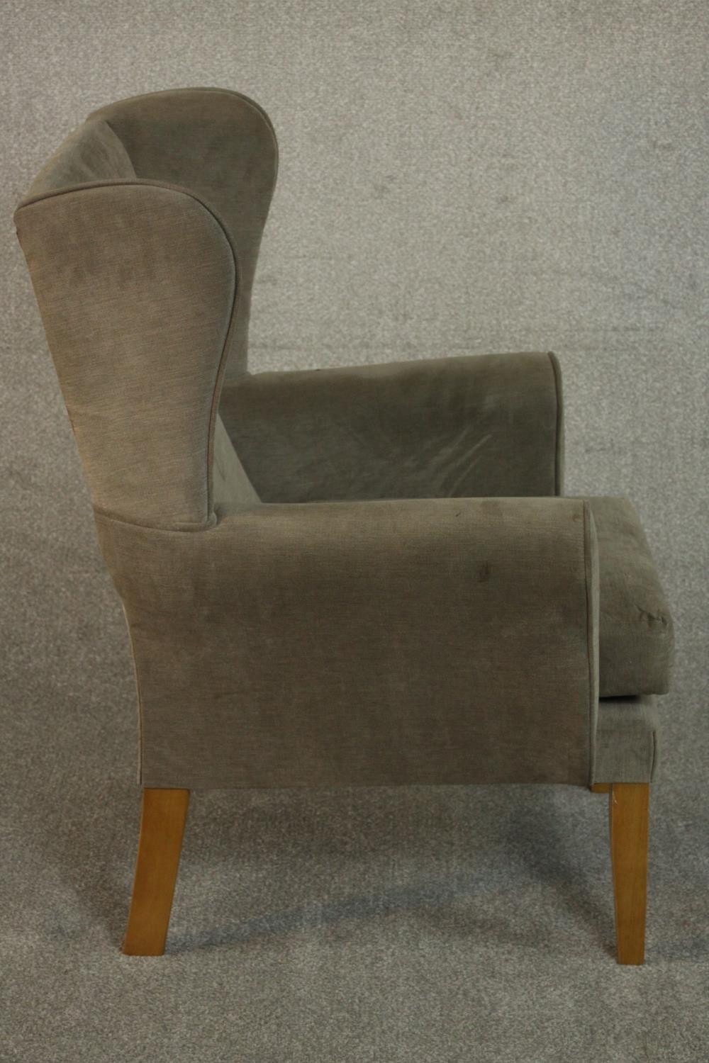 A contemporary wingback armchair in velour upholstery. - Image 4 of 6