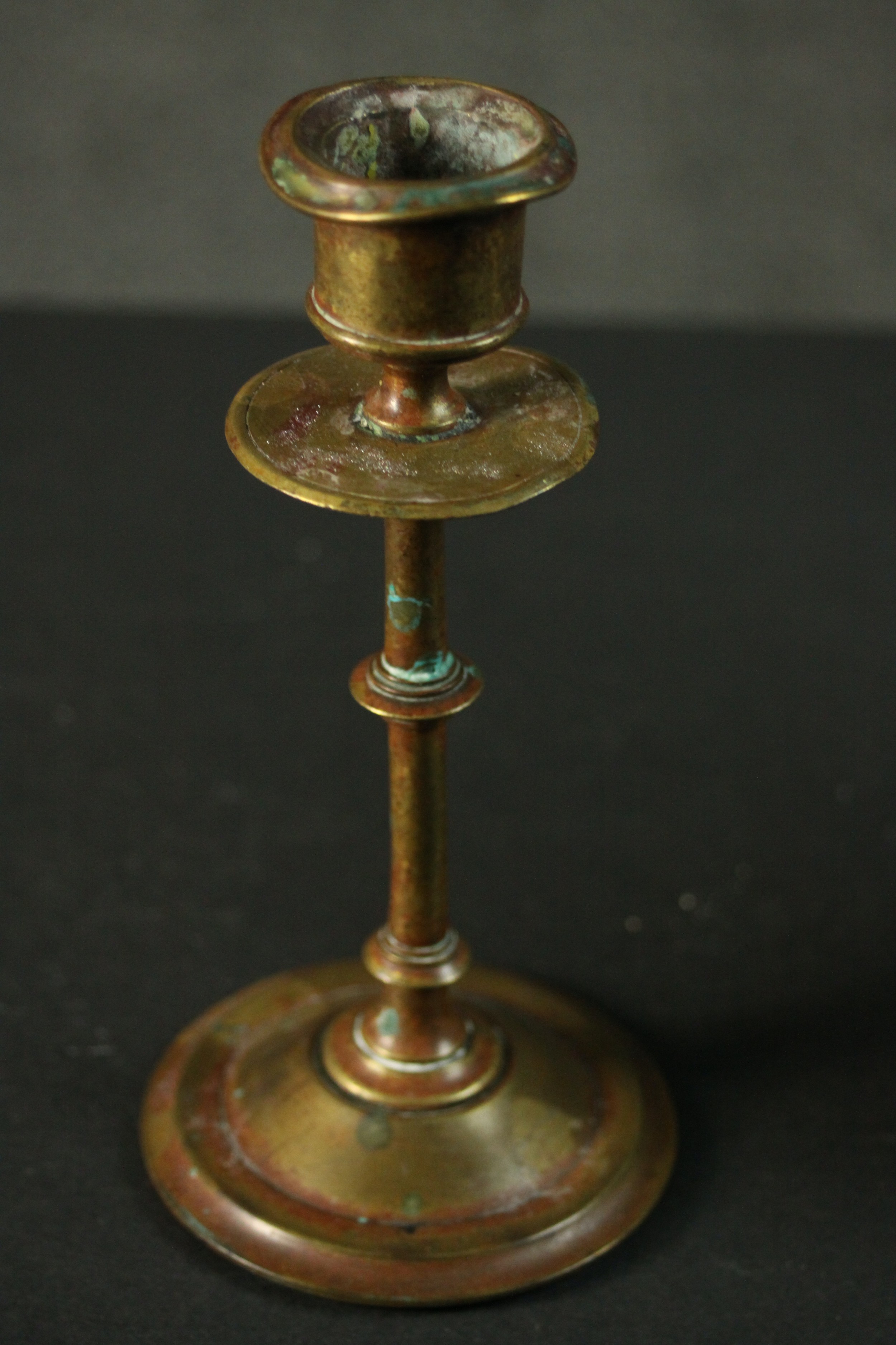 Three Indian brass items, comprising an ornately decorated candlestick, another candlestick, and a - Image 5 of 6