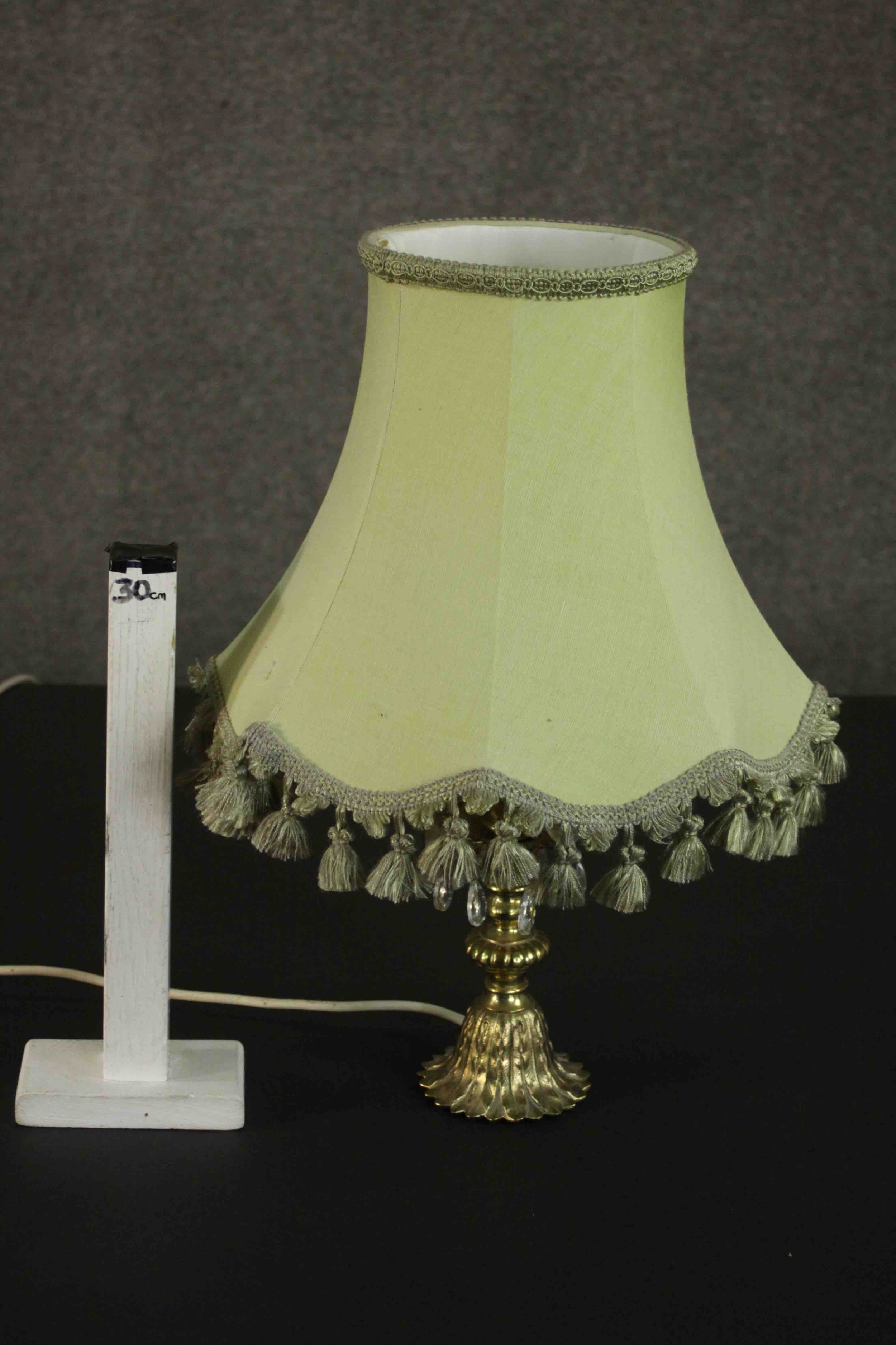 A brass table lamp, hung with faceted glass lustres on a cast feather base, with a pale green shade. - Image 2 of 5