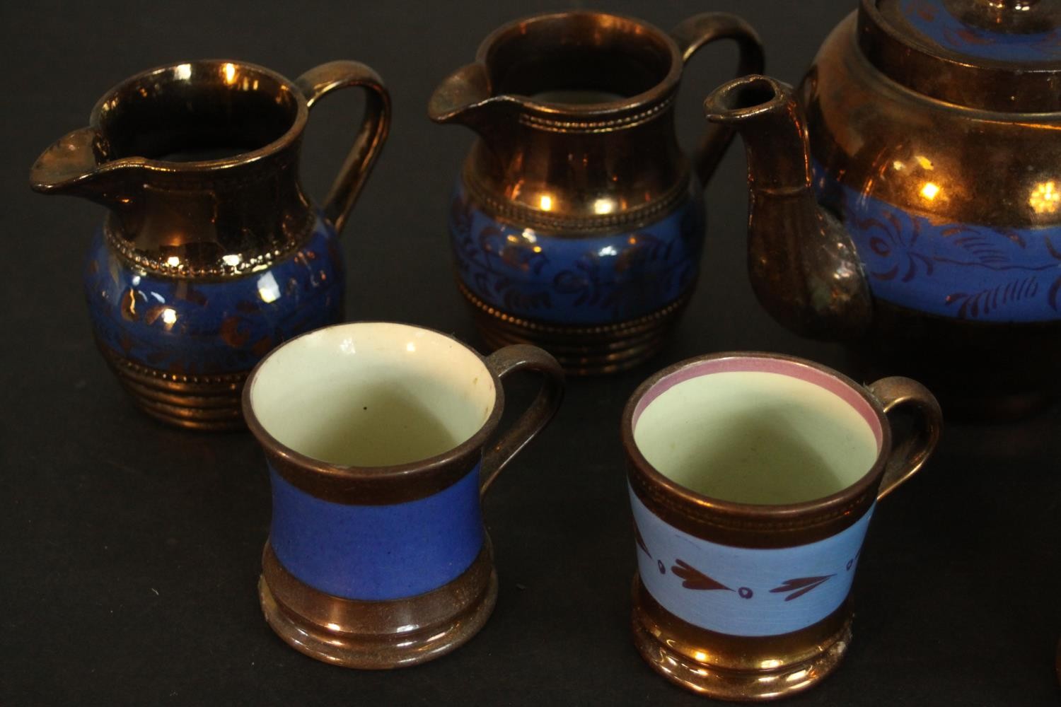 A collection of 19th century copper lustre items, comprising a teapot, jugs, cups, and a preserve - Image 5 of 8