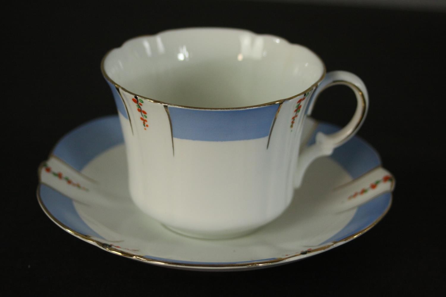 A Heathcote China part tea set, the blue border decorated with trails of flowers. Dia.16cm. ( - Image 3 of 5