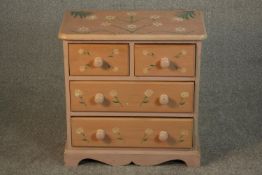 A small Victorian style painted chest of two short over two long drawers with knob handles,