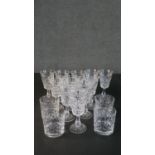 A collection of eleven hand cut Stuart crystal sherry glasses along with four Edinburgh crystal