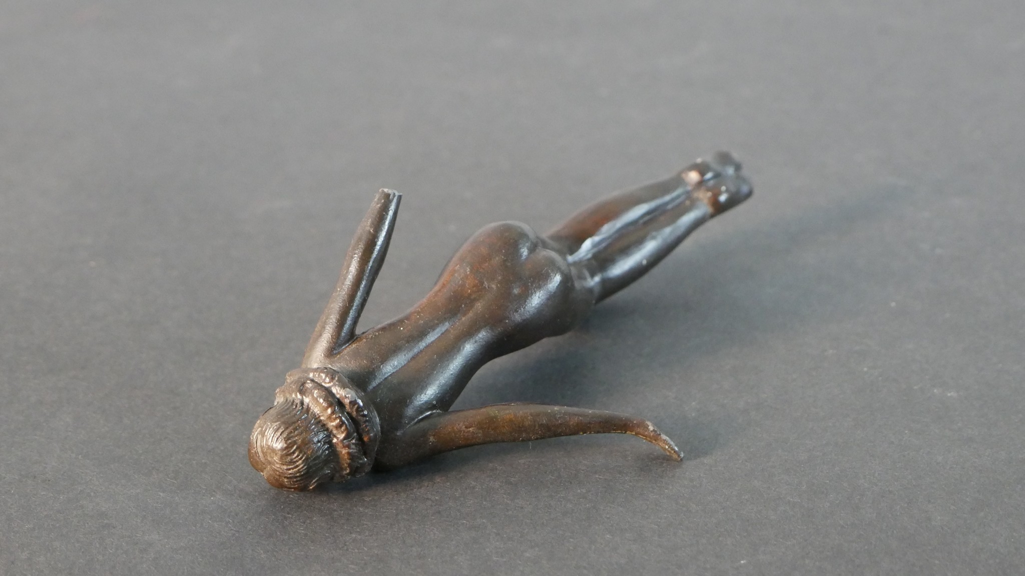 A bronze figure of a man smoking a pipe along with a spelter figure of a female swimmer (arm broken) - Image 8 of 8