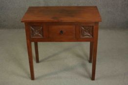 A contemporary Eastern hardwood lowboy, the rectangular top over a single drawer flanked by two