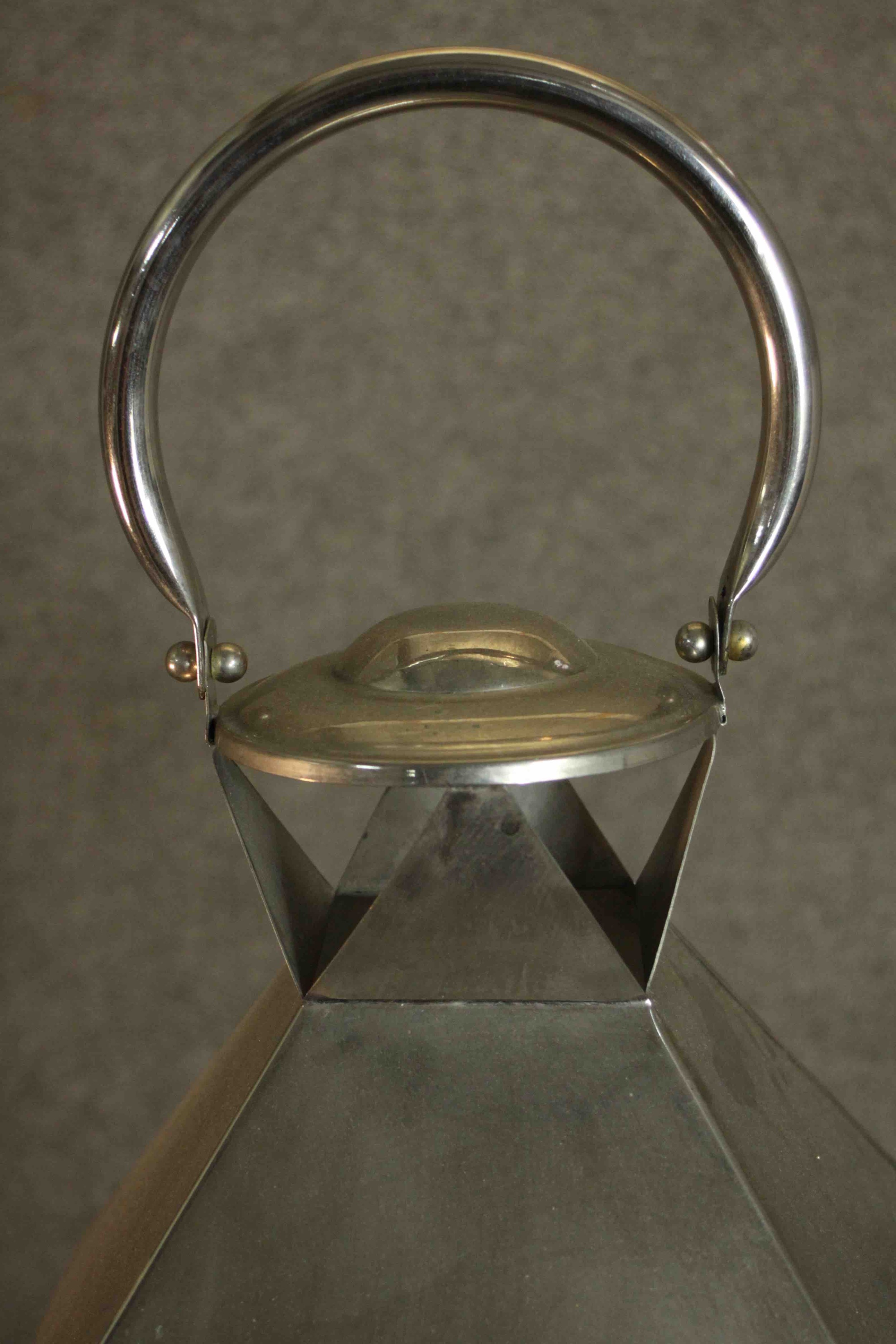 A contemporary nickel plated storm lantern, with a loop handle above a sloped top, with four - Image 3 of 5