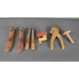 A group of treen and folk art items, including a Scandinavian chip carved shoe stretcher, a pair