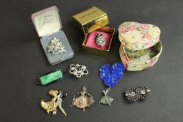 A collection of costume jewellery brooches, including a boxed Butler & Wilson diamante lemon brooch,