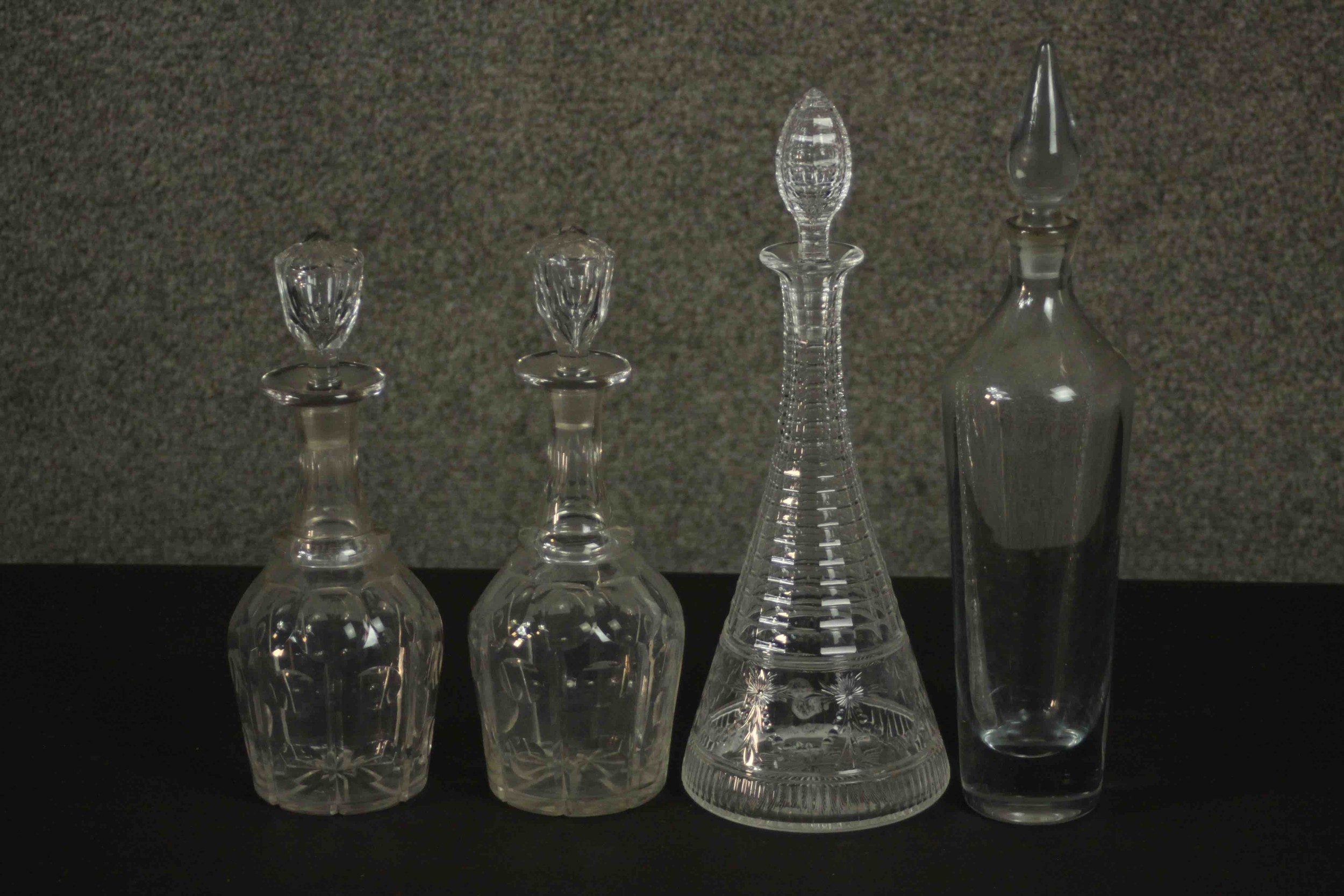 A pair of 19th century hand cut crystal decanters along with a 19th century decanter with slender