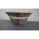 A Tribal carved bowl with engraved linear detailing. Dia.40cm.
