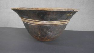 A Tribal carved bowl with engraved linear detailing. Dia.40cm.