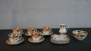 A Phoenix Ware, and Burgess Brothers Carlisle Ware harlequin tea set to seat five, decorated in