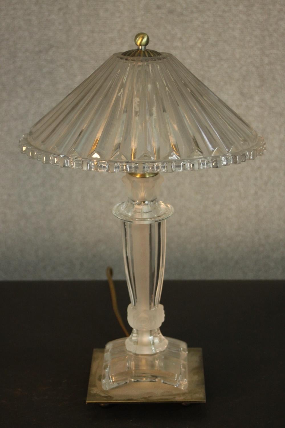 A glass table lamp with a holophane style shade, on a square base. H.45 Dia.28cm.