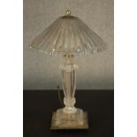 A glass table lamp with a holophane style shade, on a square base. H.45 Dia.28cm.