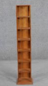 A contemporary cherry wood CD rack, seven tiers high. H.107 W.23 D.20cm.