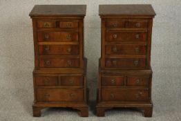 A pair of Georgian style flame mahogany miniature chest on chests. H.77 W.38 D.28cm.