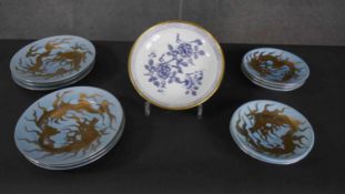 A hand painted gilded dragon part Japanese tea set of five saucers (one damaged) and six side plates