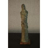 A bronze resin figure of a lady draped in cloth. H.56 W.14cm.
