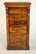 A William IV rosewood Wellington chest with acanthus carved corbels and locking stile to one side on