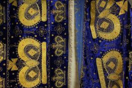 A pair of liturgical or wedding cloths embroidered using gold thread with crown motifs on a blue