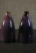 A pair of contemporary ceramic vases, with experimental glaze in hues of purple. H.30 W.16 D.8cm. (