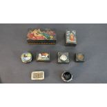 A collection of hand painted Russian boxes with various designs. H.4.5 W.16 D.8cm (largest)